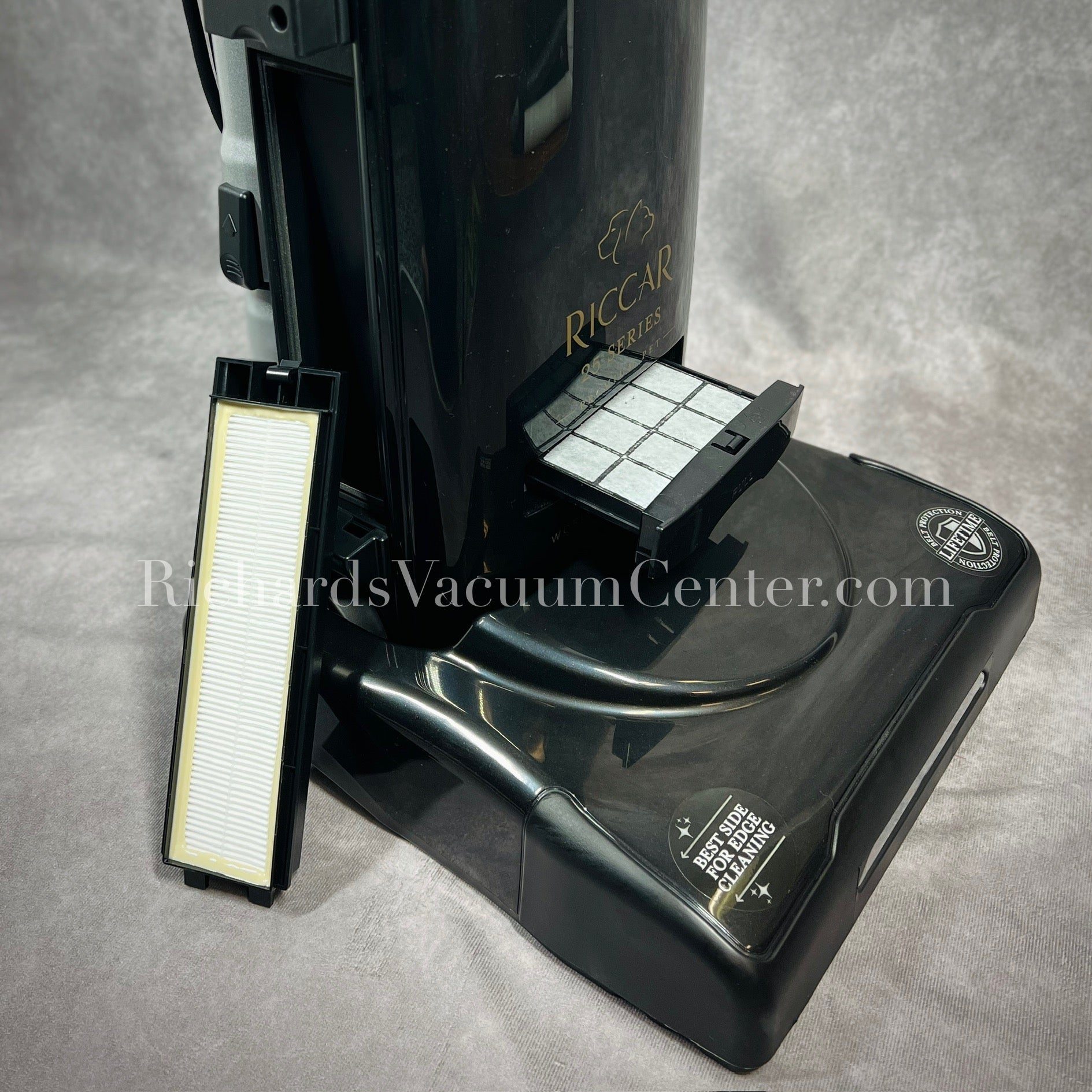 Black vacuum cleaner with filters.