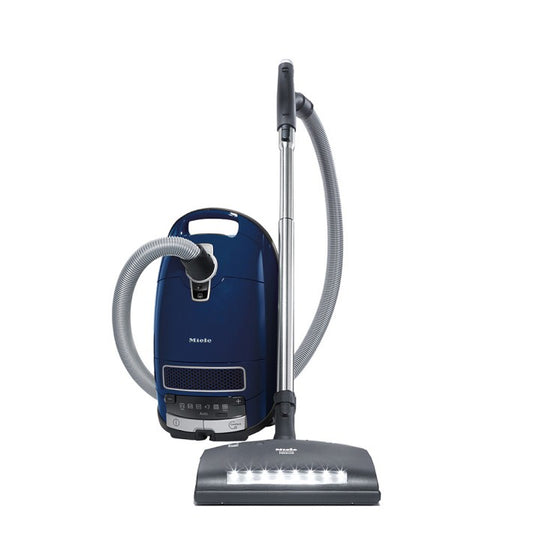 Miele vacuum cleaner on a white background with carpet nozzle