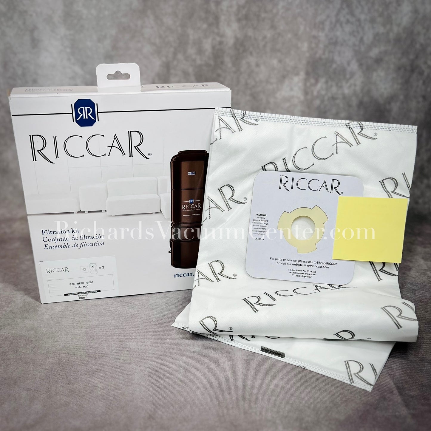 A pack of Riccar HEPA vacuum bags displayed alongside their packaging which has the brand name and product information visible.