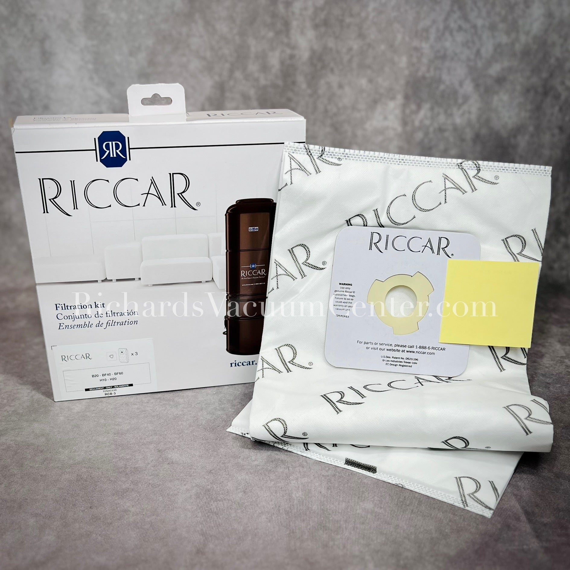 A pack of Riccar HEPA vacuum bags displayed alongside their packaging which has the brand name and product information visible.