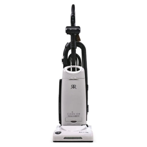 White vacuum cleaner with black attachments on a white background