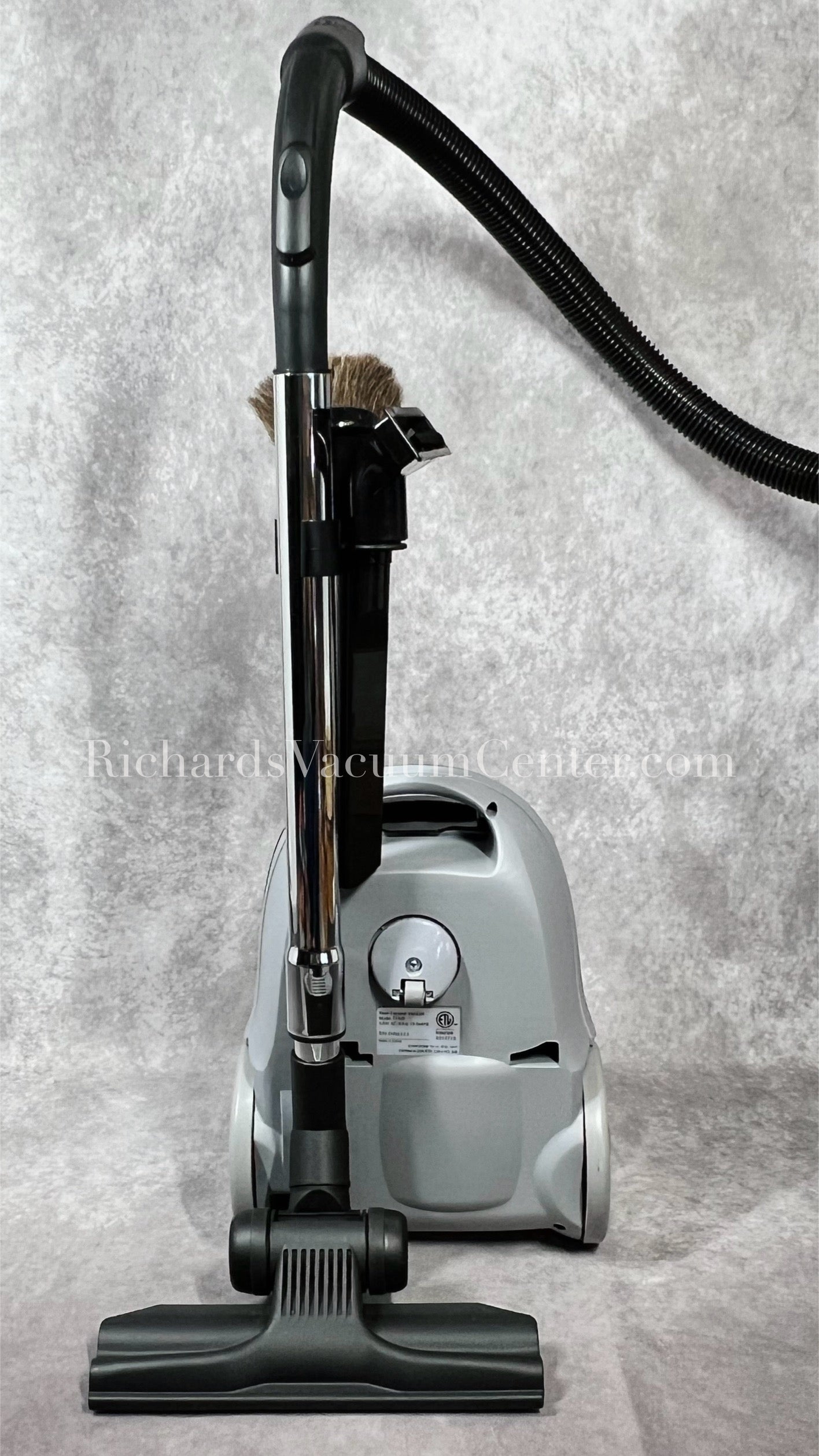 Titan T1400 canister vacuum showing how tools store on vacuum for easy storage when not in use.